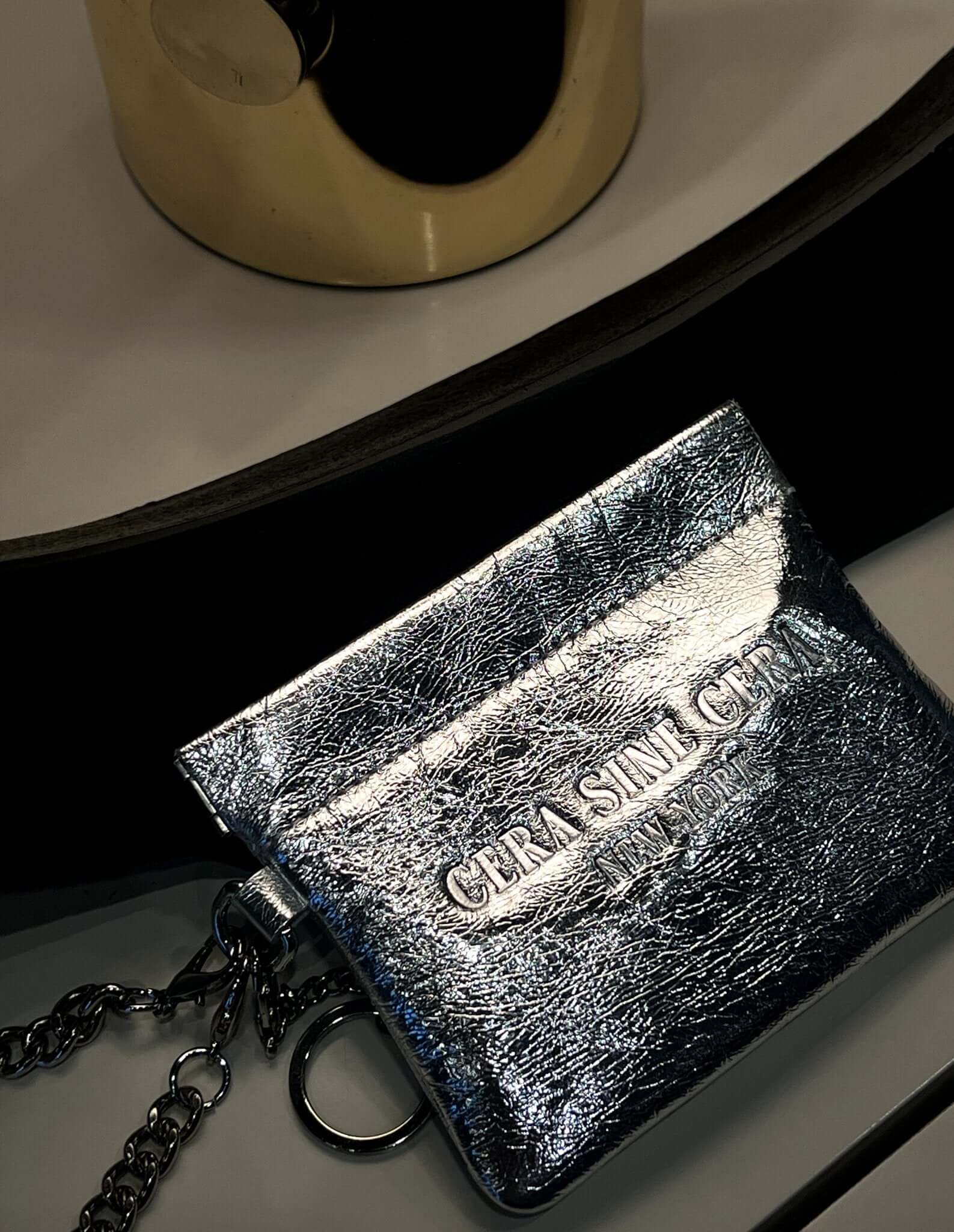 Cera's Wristlet Pouch by Cera Sine Cera - Stylish silver keychain designed to hold scents and fragrant perfume oils securely. Part of our accessory collection.