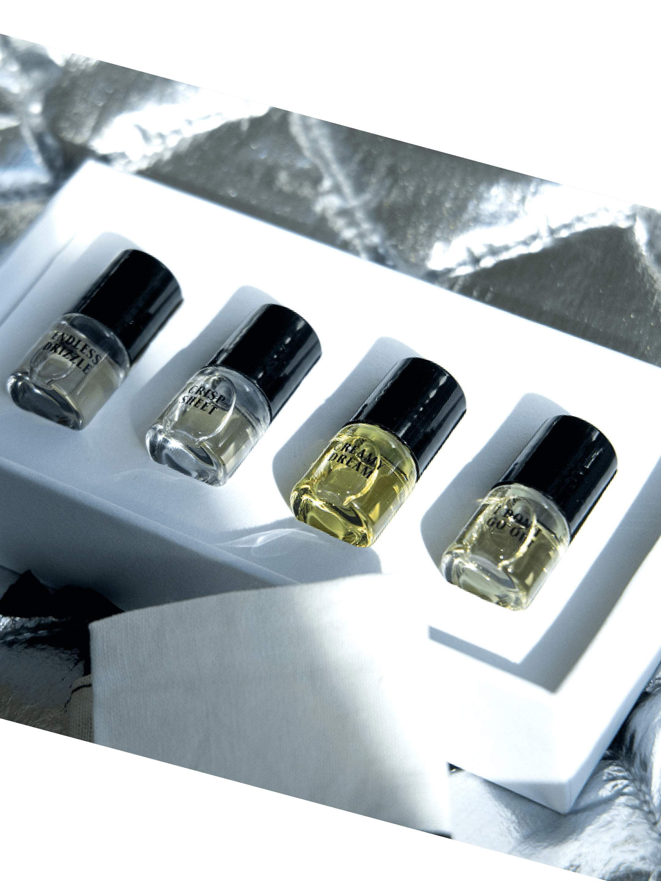 The Dreaming Sample Kit - 4x2ml Roll-On featuring four mini roll-on bottles arranged neatly in a white box.