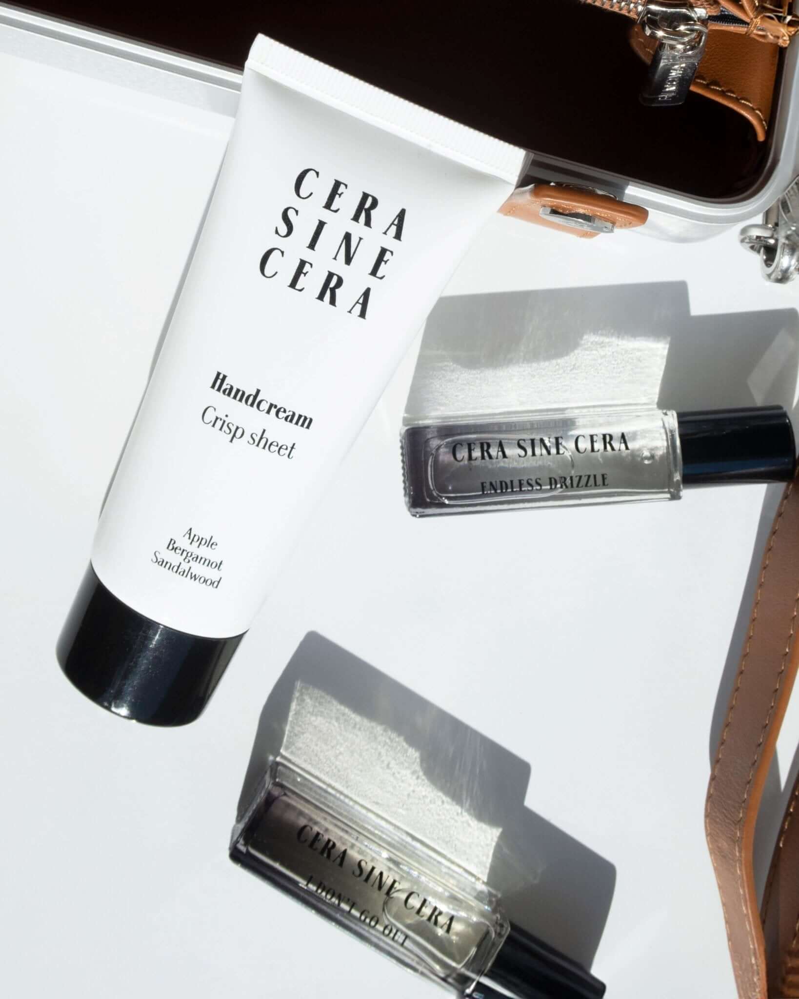 Endless Drizzle Perfume Oil - 10ml roll-on portable size by Cera Sine Cera, fragrance notes of Freesia/Orange Flower/Amber Musk for a Fruity Floral Relaxing scent. Non-alcoholic, non-toxic, Vegan, and cruelty free.