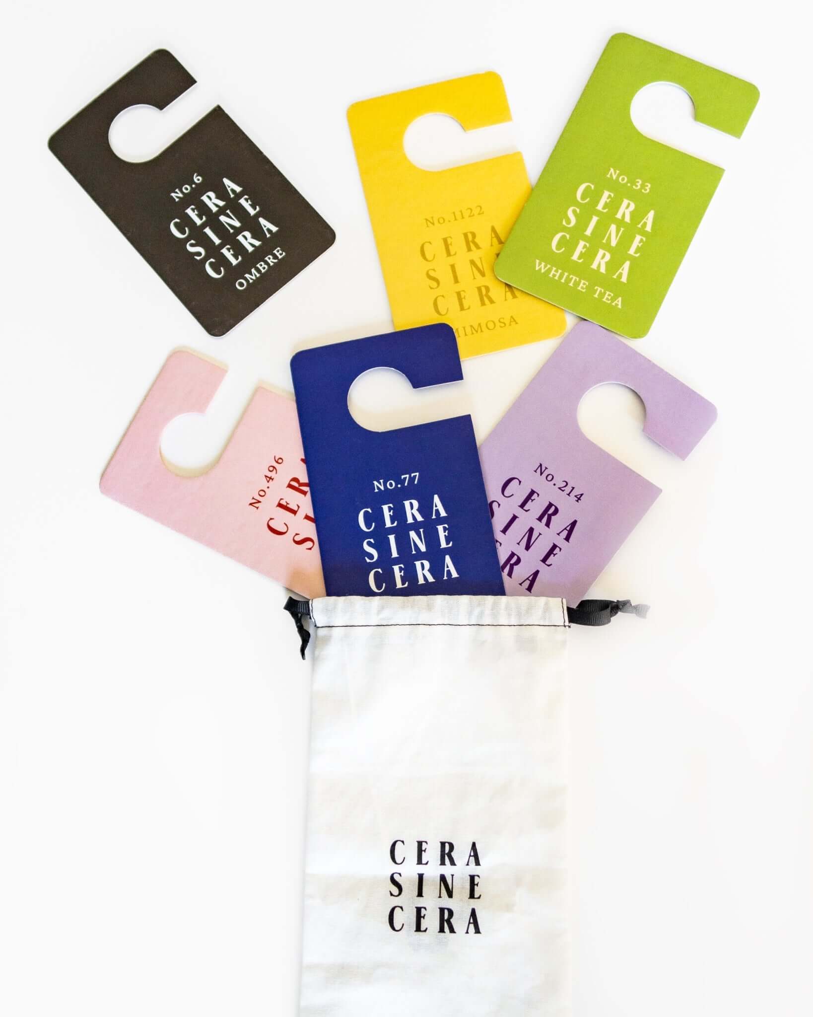 The Cera Tags Set - CeraSineCera. Clove, Iris, White Tea, Ombre, Rose, and Mimosa Fragrance Tags. 6 different scents and fragrances. Used as a room diffuser, closet diffuser, car air refresher, and any bag.