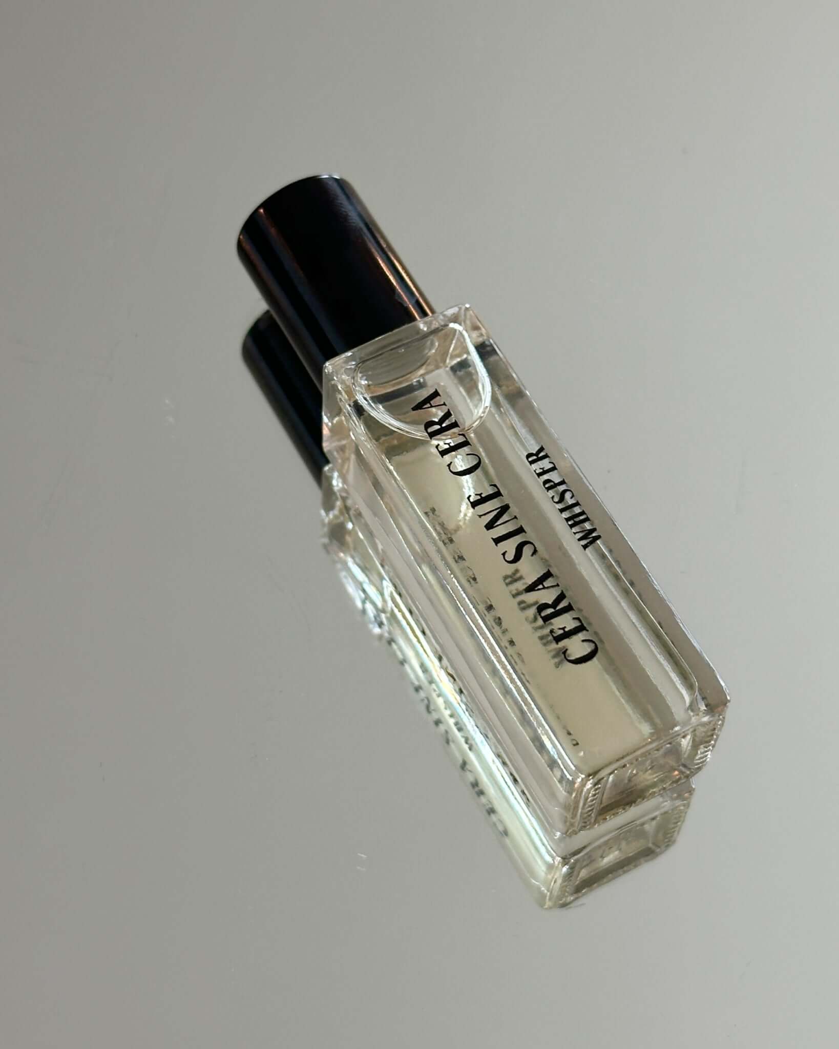 Whisper Perfume Oil - 10ml roll-on by Cera Sine Cera, fragrance notes of Orange Blossom/Jasmine/Bourbon Vanilla. Scent of Floral Creamy Warm. Non-alcoholic, non-toxic, Vegan, and cruelty free.